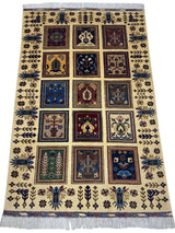 Hand-knotted Afghani Bakhteyari wool rug with cream background, multicolored rectangular floral motifs arranged in a grid, and decorative borders with floral and geometric patterns.