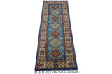 A narrow, hand-knotted Afghani Kazak wool runner rug featuring a central blue field with alternating red and cream geometric medallions, framed by a cream border with red and blue star motifs.