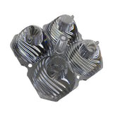 Clear plastic race pod flood projector with four lens compartments arranged in a square, each featuring curved ribbed textures and mounting holes on the corners.