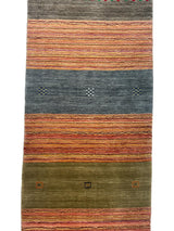 Hand-loomed Indo-Gabbeh runner rug featuring horizontal bands of rust orange stripes, muted blue with small geometric motifs, and olive green with scattered square accents.