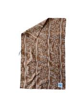 FLORAL FIELDS kitchen towel showing floral and geometric prints on each side