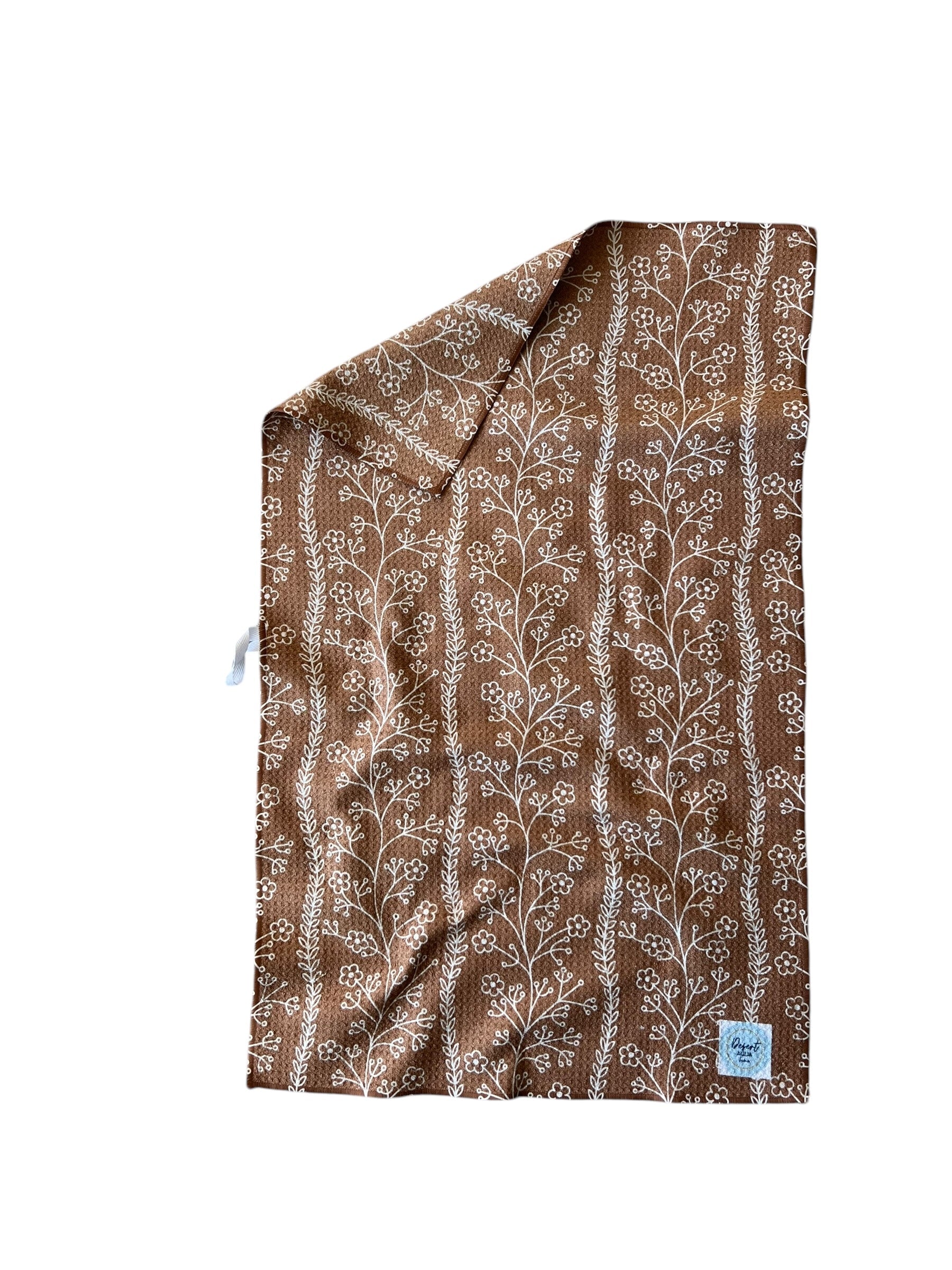 FLORAL FIELDS kitchen towel showing floral and geometric prints on each side