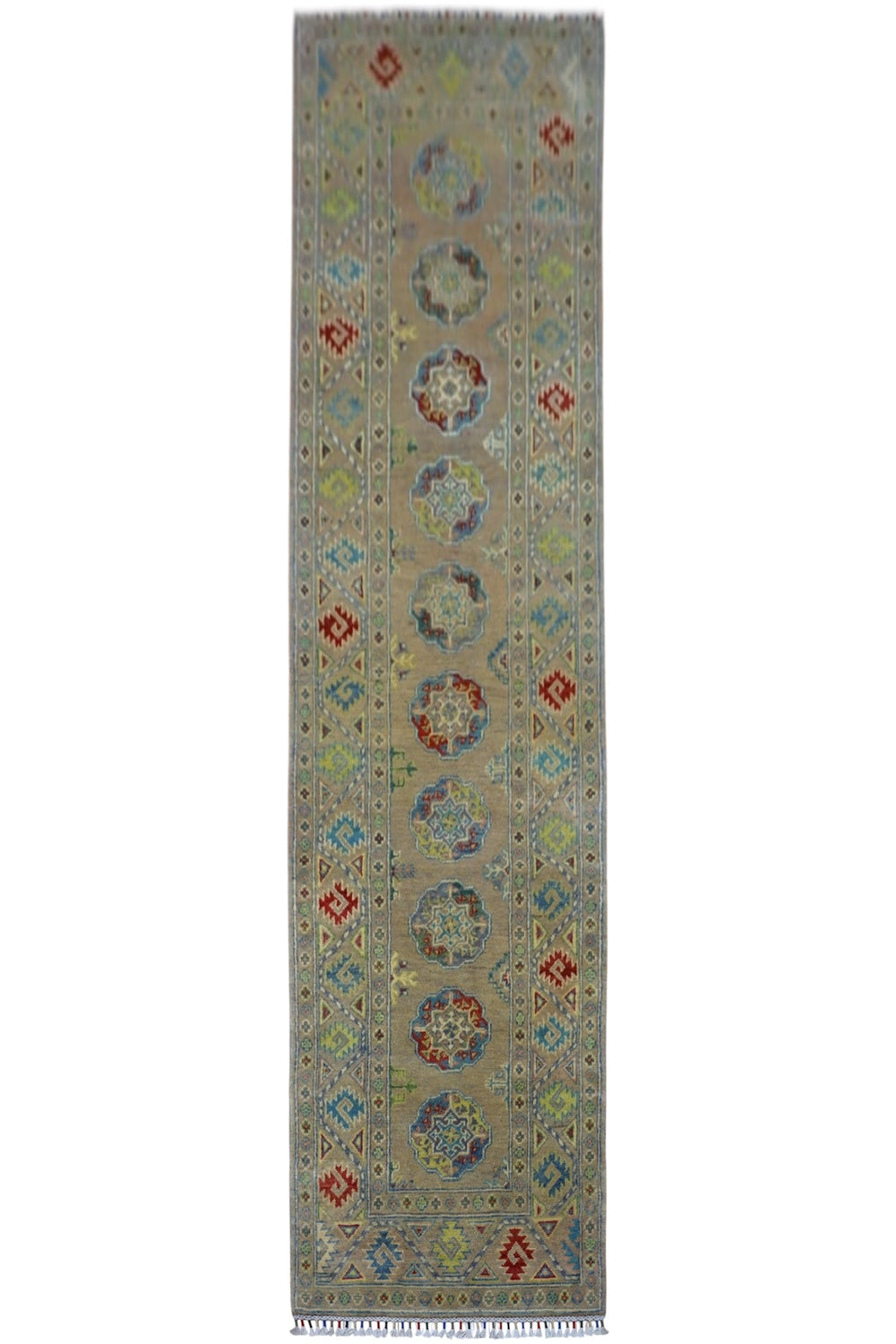 Hand-knotted Afghani Kazak wool runner rug in pistachio color, displayed on wood flooring