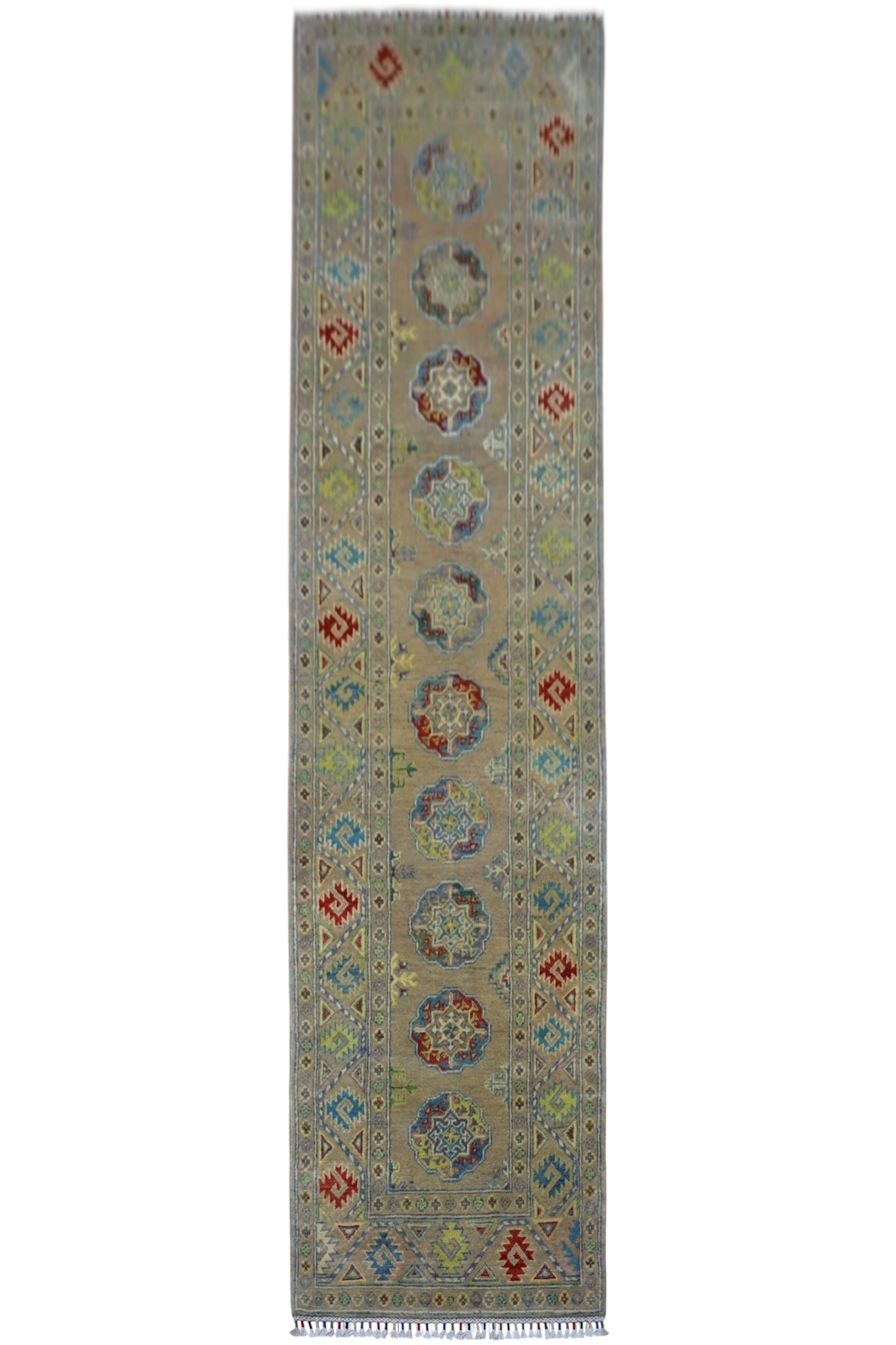 Hand-knotted Afghani Kazak wool runner rug in pistachio color, displayed on wood flooring