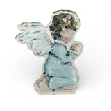 "Tiny Wings IV" Angel Acrylic Tabletop Art displayed on wooden surface with gentle natural lighting highlighting the angel illustration in acrylic block.