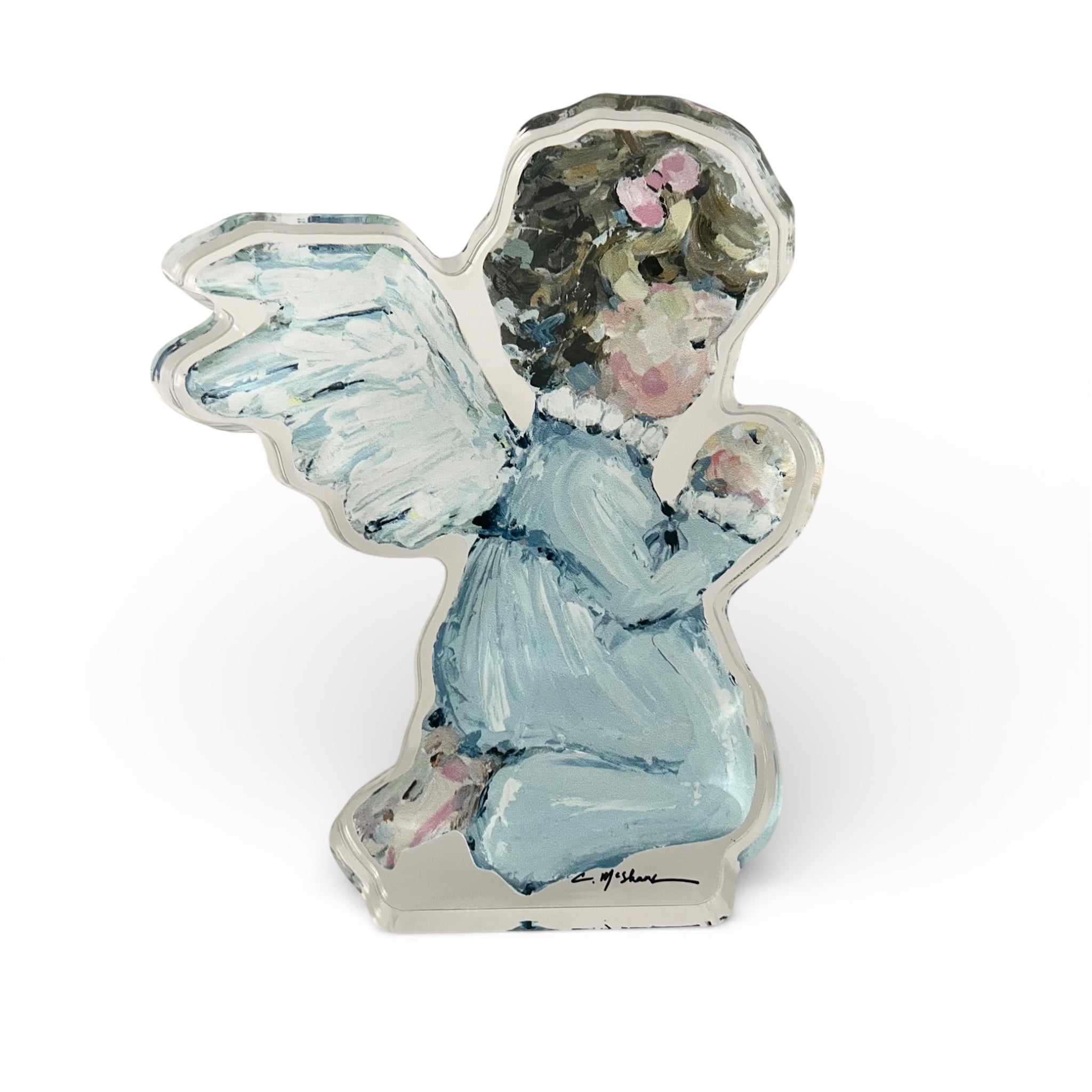 "Tiny Wings IV" Angel Acrylic Tabletop Art displayed on wooden surface with gentle natural lighting highlighting the angel illustration in acrylic block.
