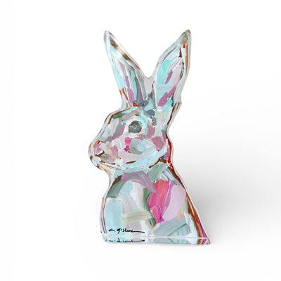 Freestanding Bunny Girl acrylic art block by Chelsea McShane on a white tabletop with a ceramic vase and art book