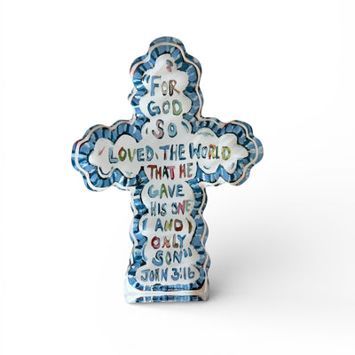 He Saved Cross Acrylic Tabletop Art displayed on a wood dresser featuring original cross artwork on thick crystal-clear acrylic.