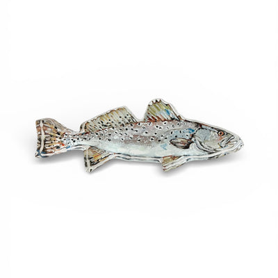 Speckled Sea Trout fish artwork printed on thick, clear acrylic block freestanding on a table