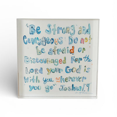 Joshua 1:9 Bible Verse Acrylic Tabletop Art in blue color, freestanding on a wooden surface