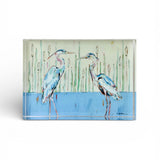Blue Herons artwork encased in a thick, weighted acrylic tabletop block