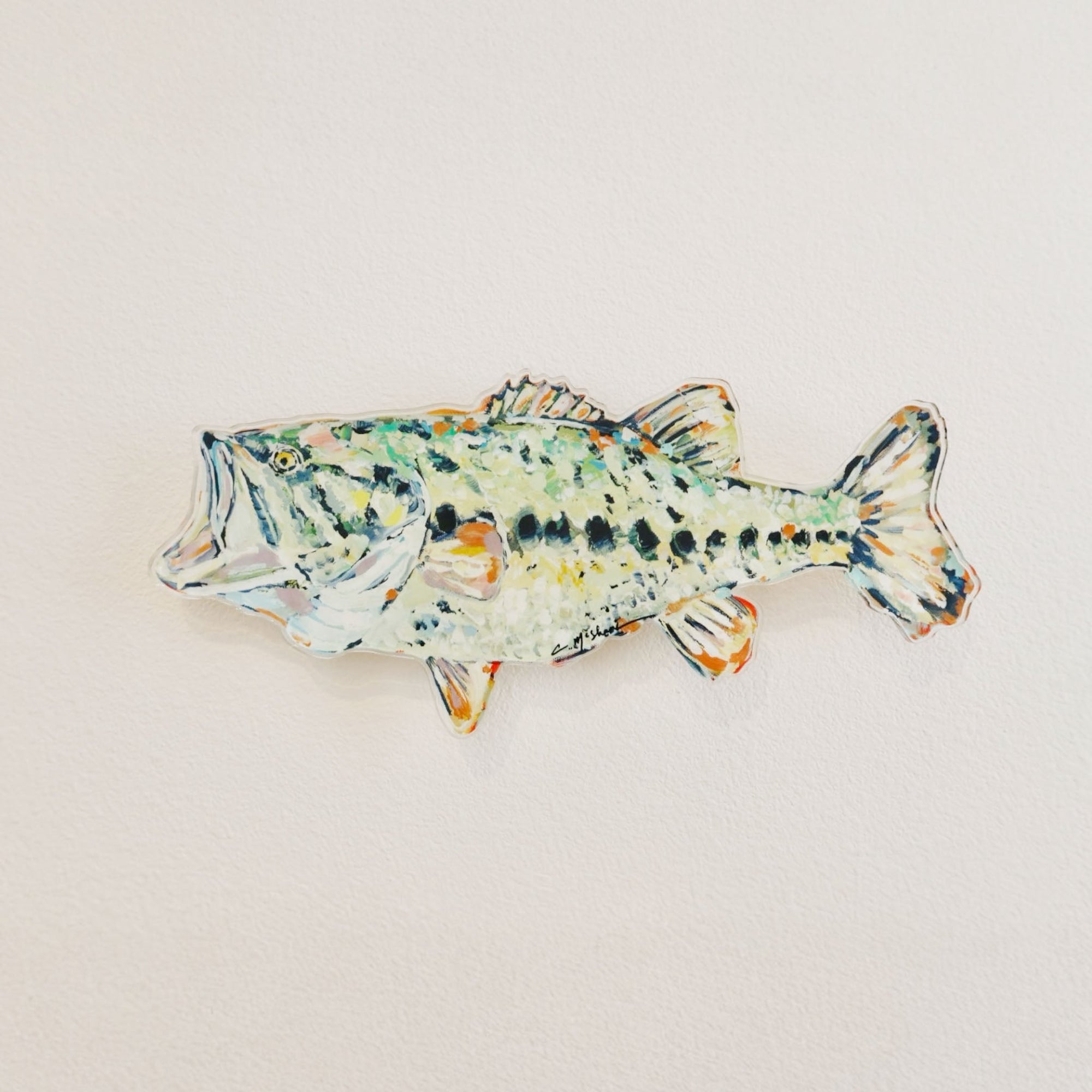 "Gone Fishin" acrylic wall art showing colorful fish shapes on a white background