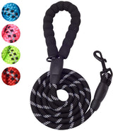 Black braided dog leash with white reflective stripes and a foam padded handle, coiled with a metal clasp for attachment.