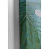 Close-up of canvas edge showing textured blue and green brushstrokes with hints of white, depicting a corner fold detail of a painted artwork.