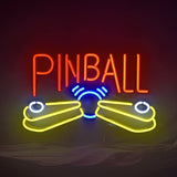Neon sign with the word PINBALL in red above yellow flippers and a blue pinball with lines indicating motion on a dark background
