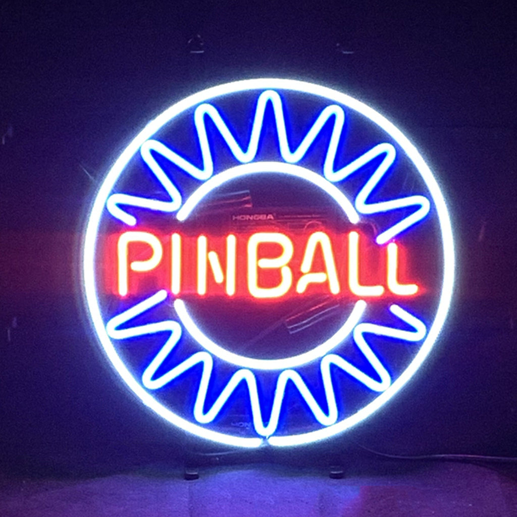 Pinball Neon Signs Light glowing mounted on a textured dark blue wall