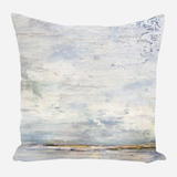 Square pillow with abstract landscape design featuring muted blue, gray, and beige tones with a textured sky and horizon line