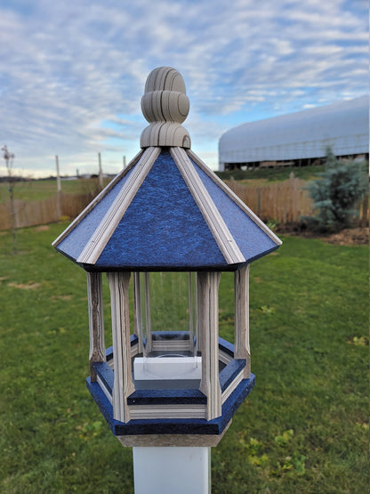 Amish handmade poly bird feeder with rustic spindle design, shown mounted outdoors