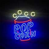 Neon sign shaped like a popcorn cup with yellow circles representing popcorn, a white curved line for the cup rim, red cup outline, and blue text spelling 'POP CORN'.