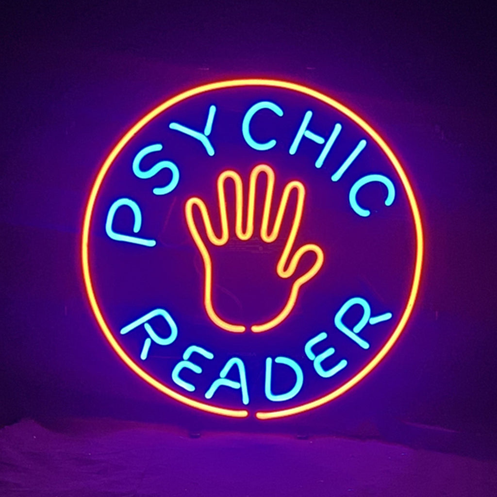 Circular neon sign with an orange outline and central hand graphic, featuring blue text reading "PSYCHIC READER" around the hand, glowing against a dark background.