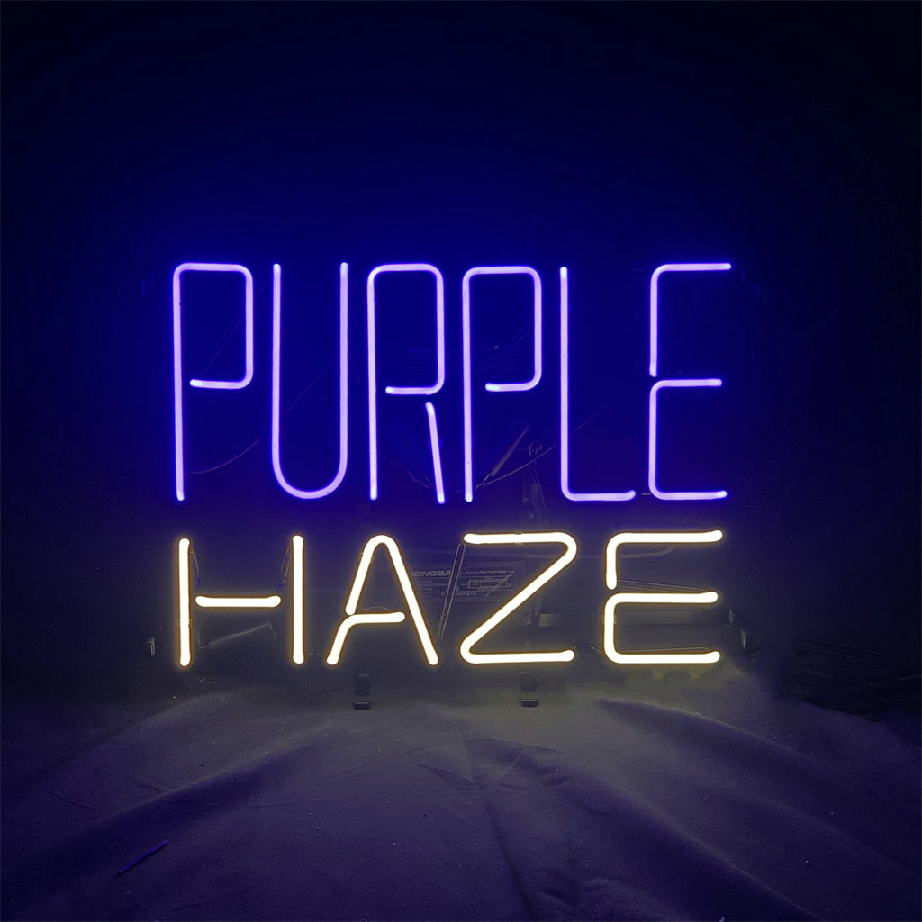 Neon sign with the words 'PURPLE' in purple light and 'HAZE' in yellow light against a dark background.