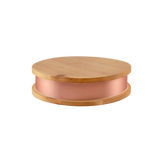Qi-Max device on a wooden surface in a modern interior setting