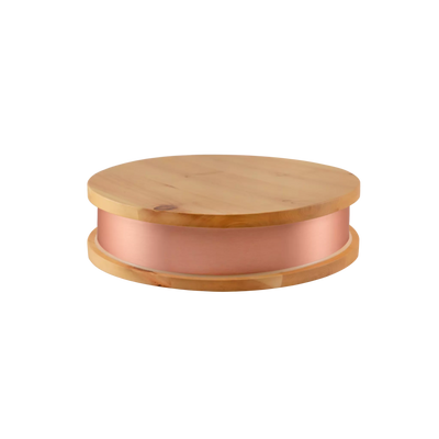 Qi-Max device on a wooden surface in a modern interior setting