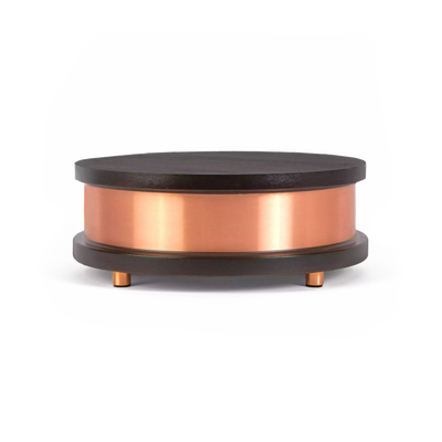 Qi-Home Cell placed on a wooden surface blending with modern home decor