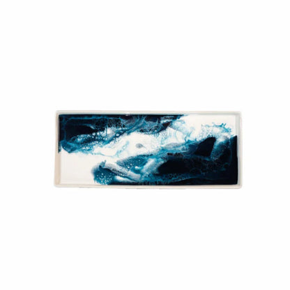 Abstract resin ceramic tray with blue and white colors on a white background