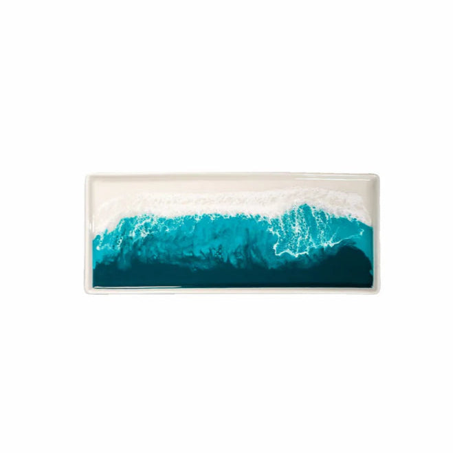 Rectangular resin ceramic tray with a blue wave design on a white background