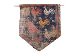 RUGLING 12 Limited Edition Persian Rug Cork Board Flag showing antique wool rug fragment with colorful rooster design, mounted with wooden dowel and copper wire
