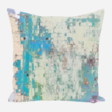 Square pillow with abstract mosaic pattern in pastel shades of blue, teal, cream, and beige, featuring soft, irregular grid texture resembling blurred stained glass.