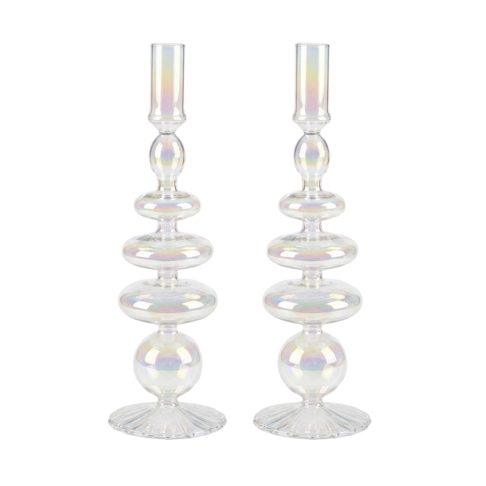 Pair of iridescent glass candle holders with stacked rounded shapes and flared bases, reflecting subtle rainbow hues on a white background.