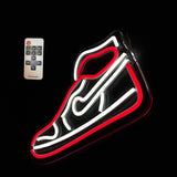 Red sneaker-shaped LED neon light outlined in white and red, shown on black background with a small white remote control nearby.