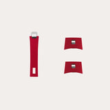 Three red resin handles with modern squared metal accents, including one long vertical handle and two smaller curved square handles, on a plain light background.
