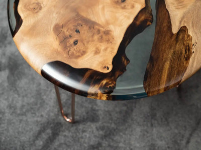 Round walnut wood side table with clear epoxy resin top and rounded edges from Osso Collection
