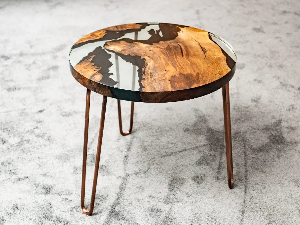 Round walnut wood side table with clear epoxy resin and straight edges