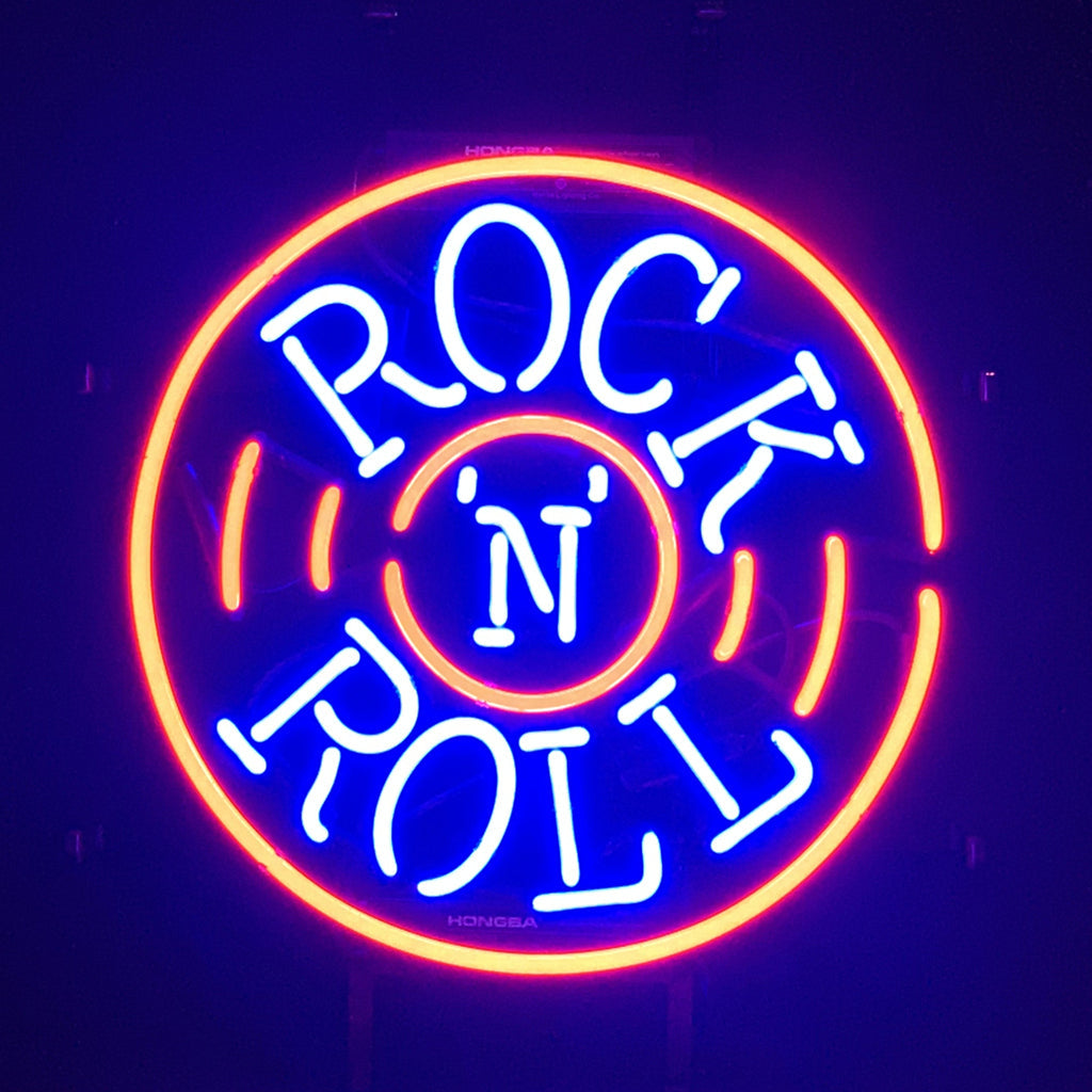 Rock N Roll neon sign light on a metal grid backing, glowing indoors