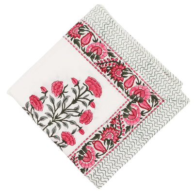 White Rose Garden Tablecloth with hand-painted pink roses and green fern patterns on a table