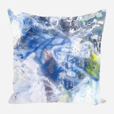 Square pillow with an abstract design featuring swirling blues, whites, and hints of yellow and green, creating a watercolor-like effect.