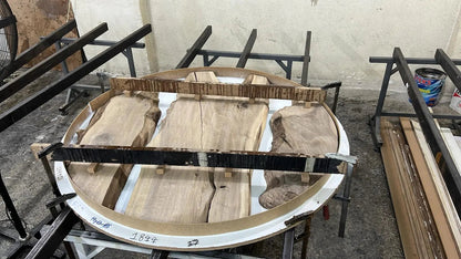 Custom round epoxy resin walnut dining table with wood and metal base