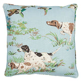 Square pillow cover with light blue background featuring illustrated hunting pointers and flying ducks surrounded by green grass and plants.