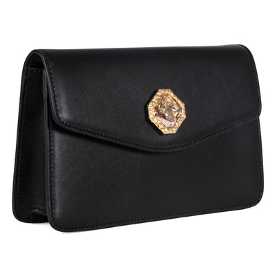 Black leather clutch with central Swarovski stone and gold chain