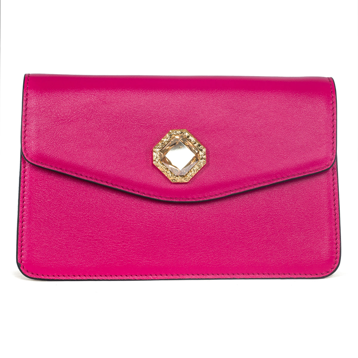 Vibrant fuchsia leather clutch with a geometric gold-tone frame featuring a large clear Swarovski stone at the center of the envelope flap closure.