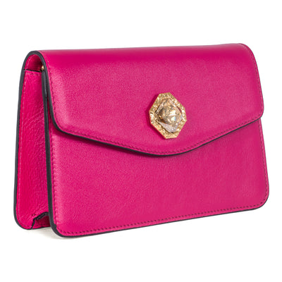 Vibrant fuchsia leather clutch with a central Swarovski crystal stone and gold chain strap.