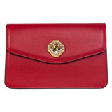 Red leather clutch with angular flap and a central gold-tone trim surrounding a large custom Swarovski stone on the front