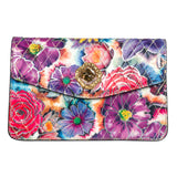 Floral leather clutch with vibrant multicolored flower prints in purple, red, pink, and blue, featuring a quilted pattern and a central gold-tone clasp with a Swarovski stone.
