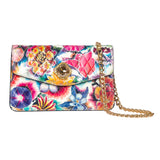 Rectangular floral leather clutch with colorful vibrant flower patterns, diamond-shaped custom Swarovski stone on flap, and gold chain strap on white background.
