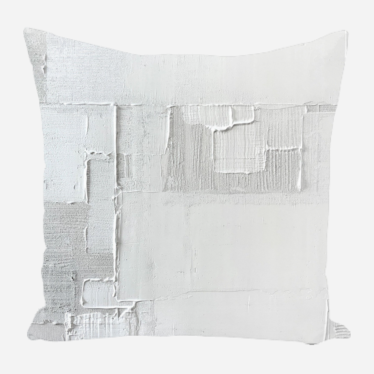 Square pillow featuring an abstract texture pattern in various shades of white and light gray, with visible brush strokes and rectangular shapes creating a layered effect.