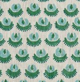 Beige fabric with a repeating pattern of stylized green and blue floral shapes arranged in offset rows.